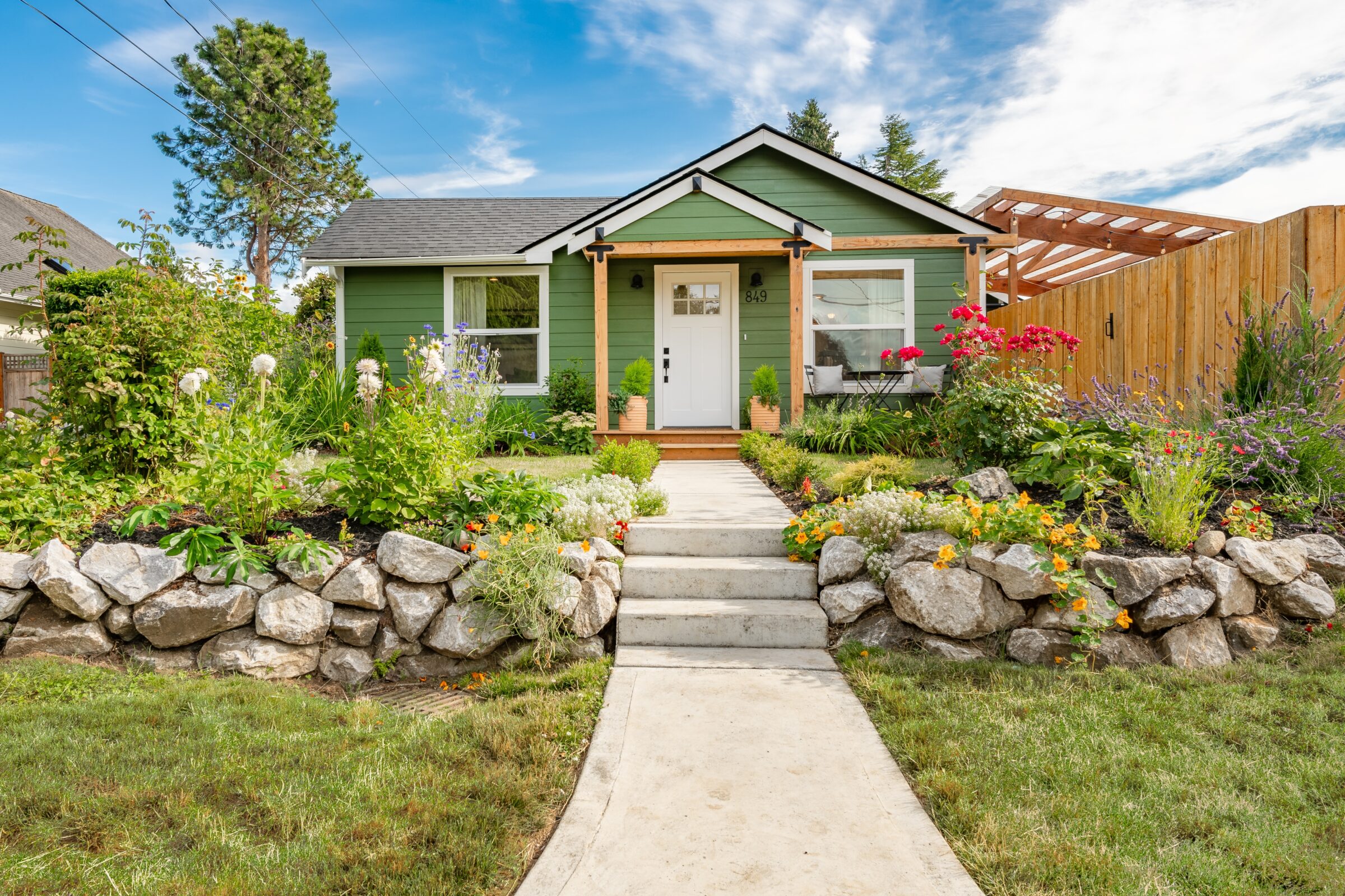 a broomfield front lawn with pretty cottage home